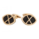 Gemelos de pelo de jirafa y oro con forma de escudo