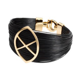 Pulsera de pelo natural de jirafa y oro con un el logo