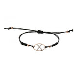 Pulsera con logo en oro rosa, nailon negro y diamantes con cierre ajustable